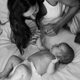 Mom with her newborn in a Rebelalike diaper, black and white