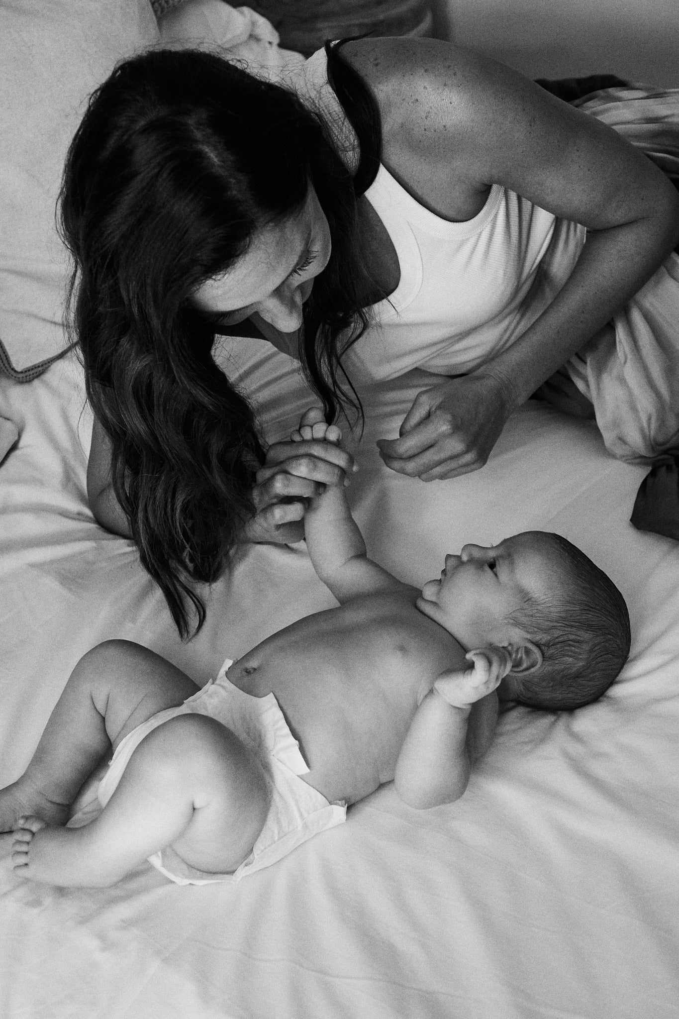 Mom with her newborn in a Rebelalike diaper, black and white