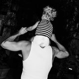 Dad carrying a toddler in a Rebelalike diaper on his shoulders, black and white