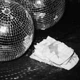 Rebelalike printed diapers next to disco balls, black and white