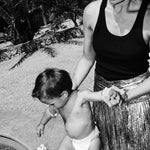 Mom and toddler in a Rebelalike diaper at the pool, black and white