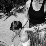 Mom and toddler in a Rebelalike diaper at the pool, black and white