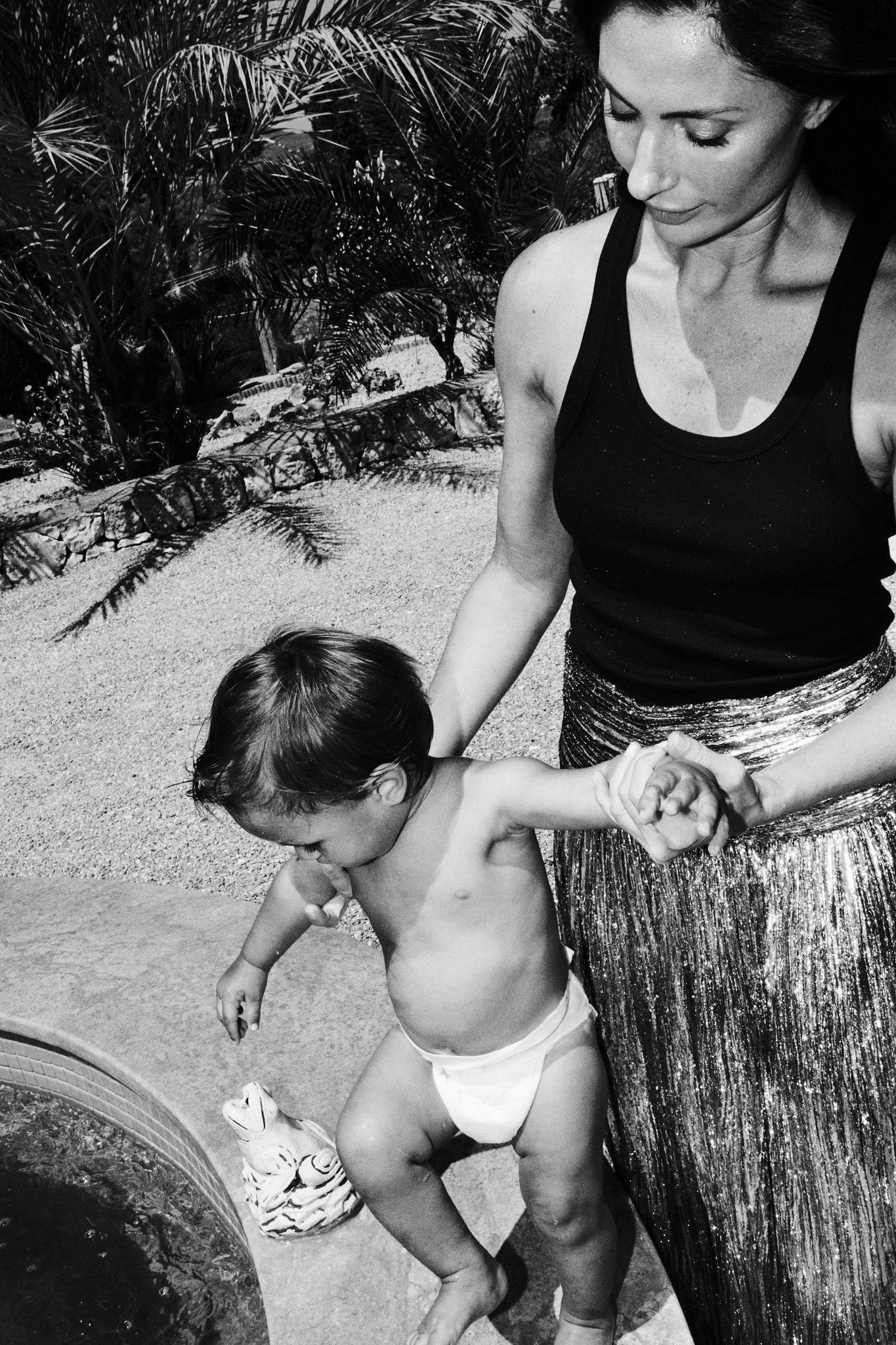 Mom and toddler in a Rebelalike diaper at the pool, black and white